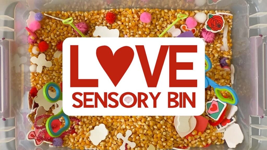 love themed sensory bin with hearts and other babbles