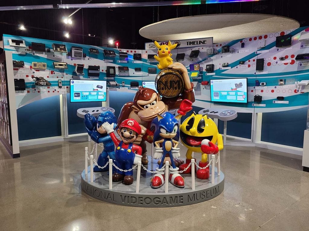 Mario, Pac-man, Donkey Kong and more stand as sculptures in the middle of the national video game museum
